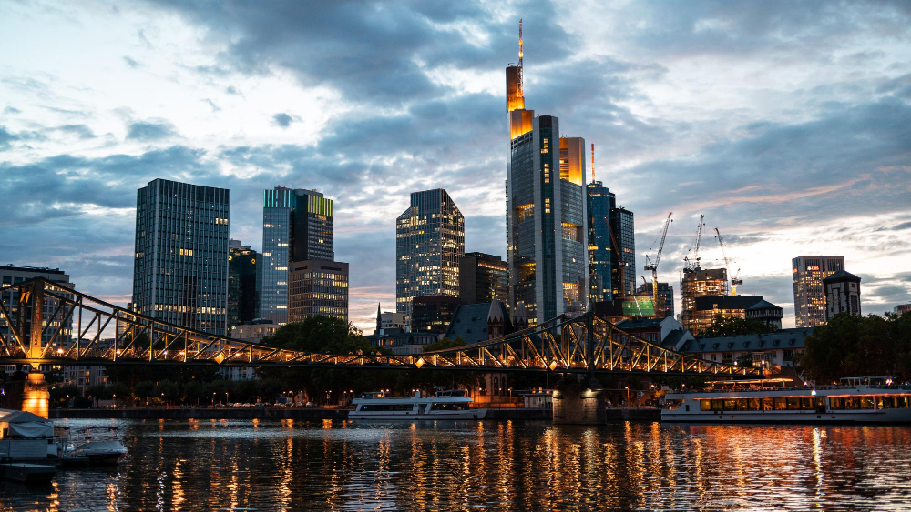 Frankfurt financial district skyline at night with Commerzbank Tower